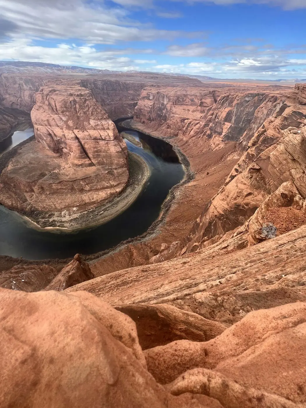 A wide canyon overlook with a river bending far below
